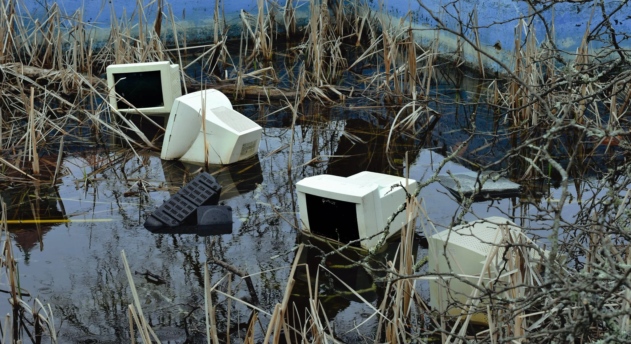 old computers in abandoned pool