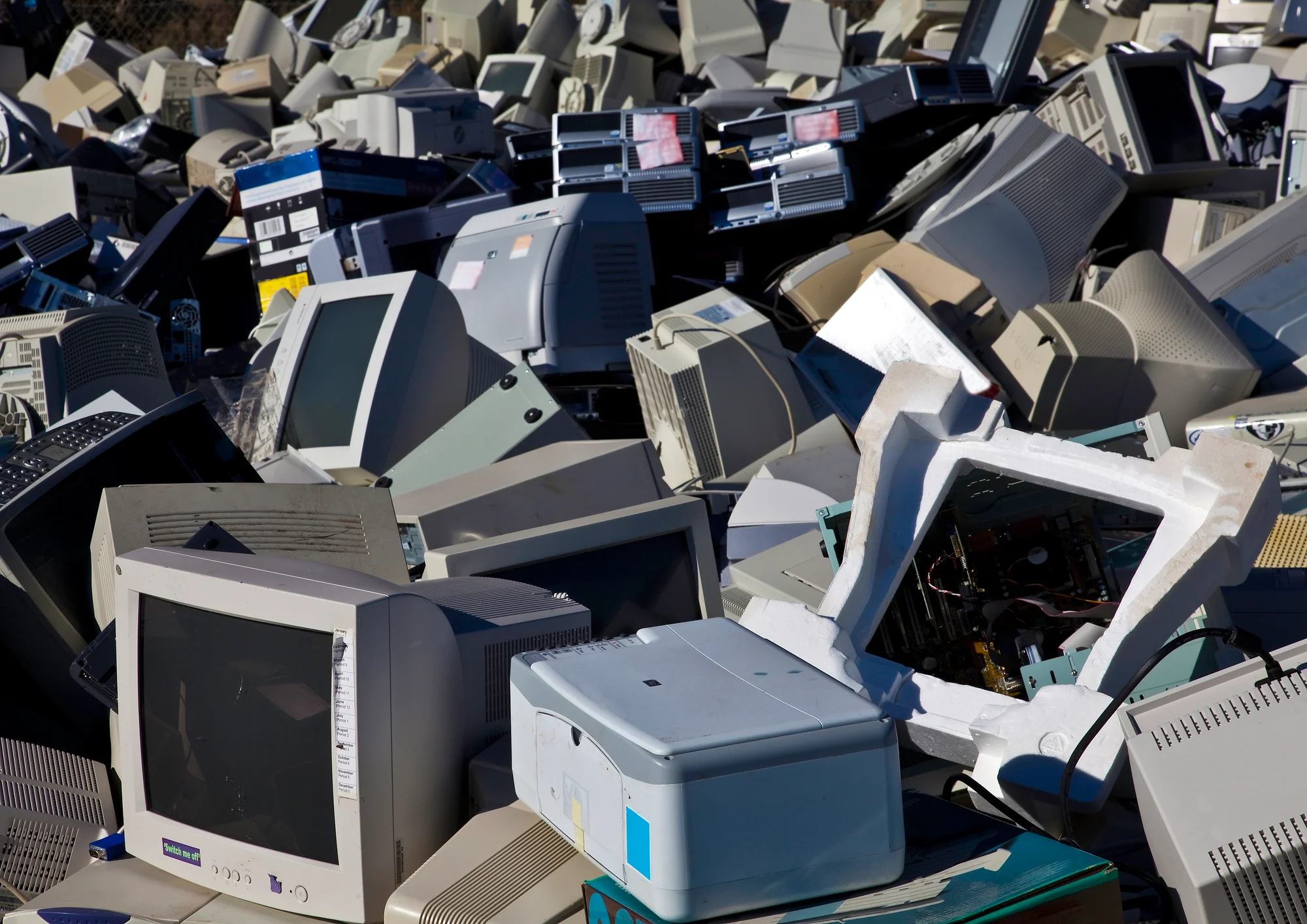 Stacks of old computers in an abandoned pool